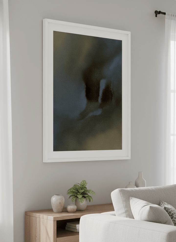 Modern wall art styled above a sofa in a neutral living room