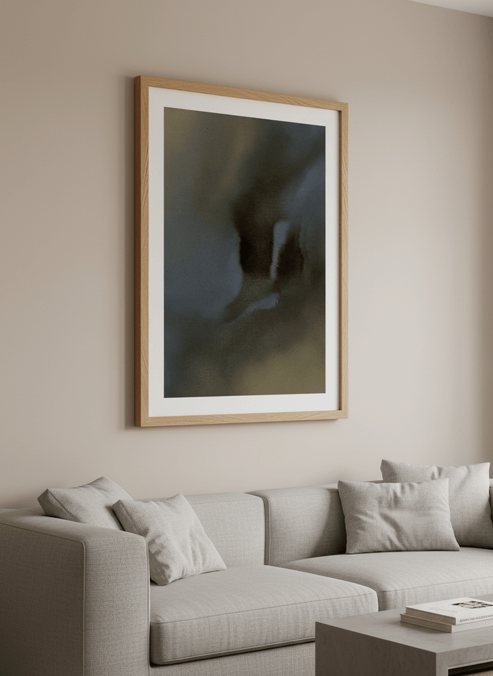 Modern wall art styled above a sofa in a neutral living room