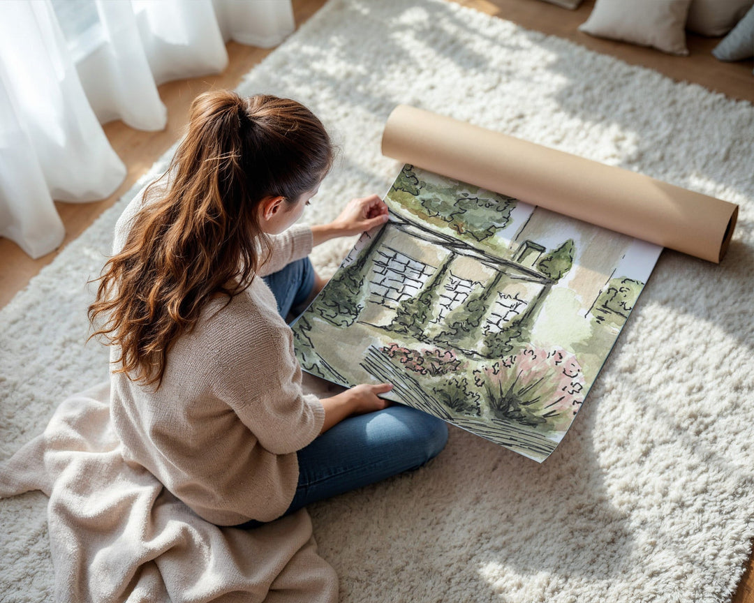 Woman unrolling a large landscape painting on a carpeted floor.
