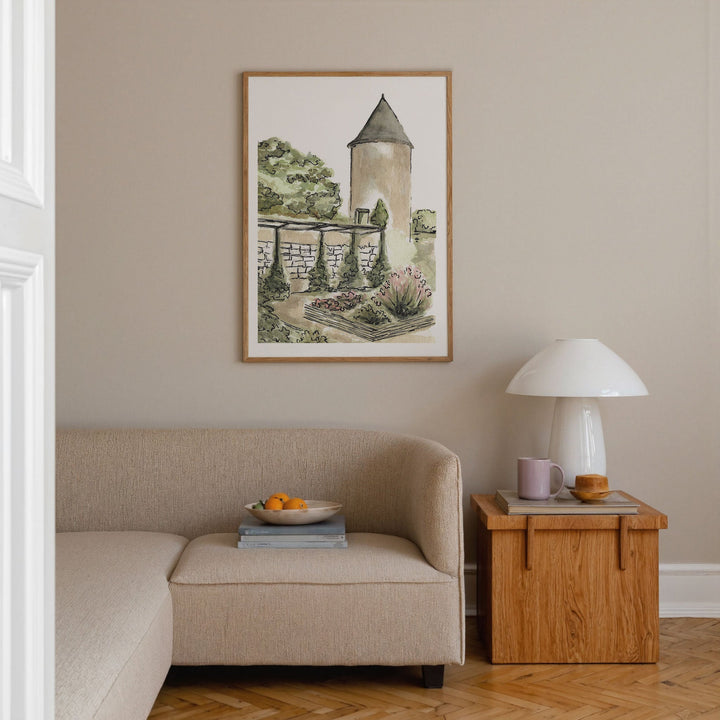 Living room with beige sofa, wooden side table, and artwork on the wall.