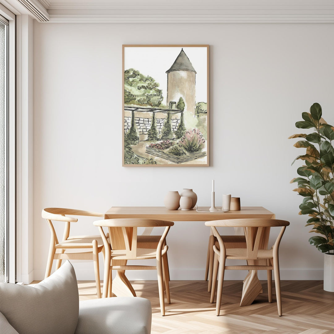 Dining room with wooden table and chairs, artwork on the wall, and a plant.