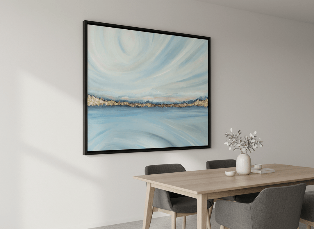 Wall art styled above a dining table in a contemporary home