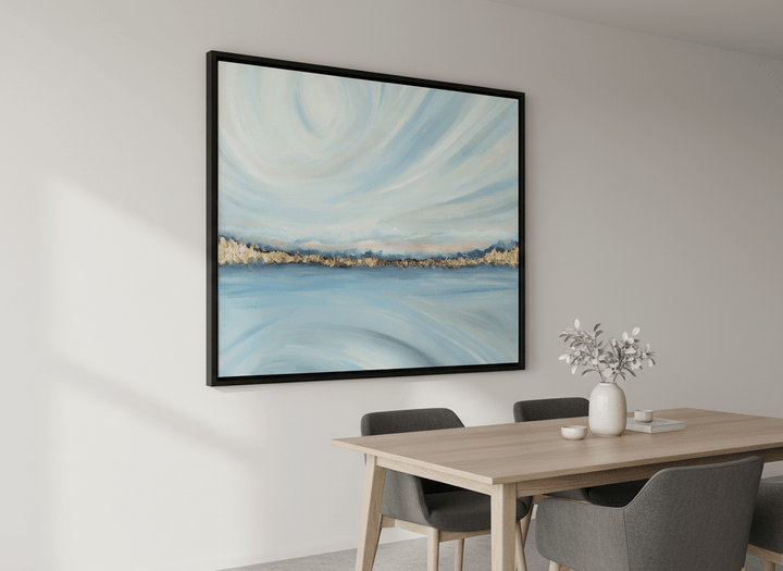 Wall art styled above a dining table in a contemporary home
