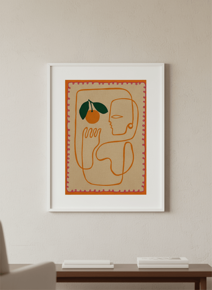 Modern wall art styled above a sofa in a neutral living room