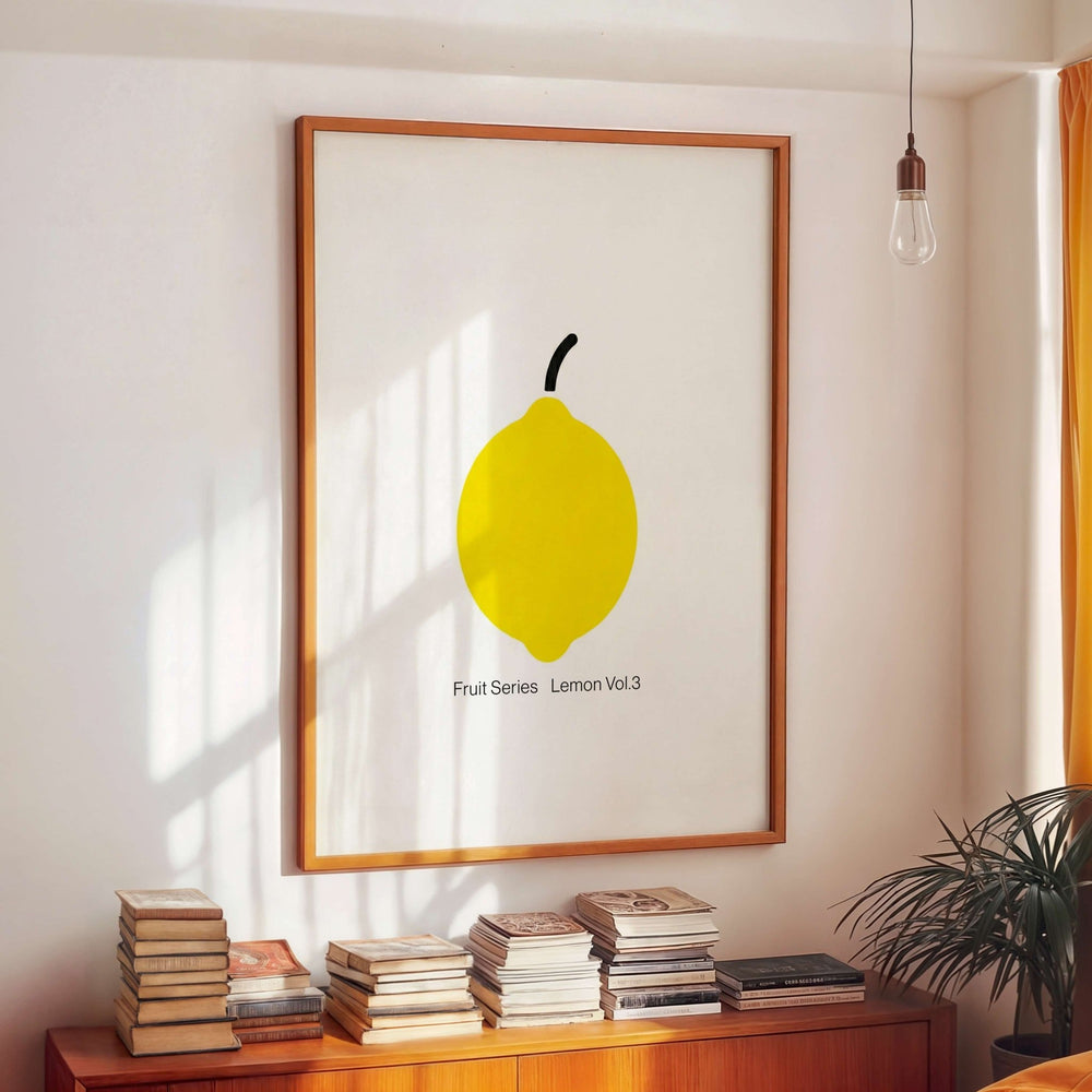 artwork of a lemon on a wall with books below