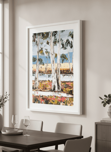 Wall art styled above a dining table in a contemporary home