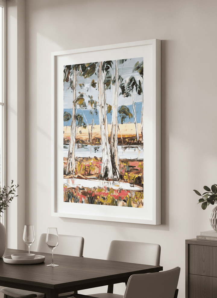 Wall art styled above a dining table in a contemporary home