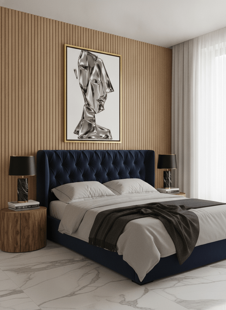 Oversized statement canvas wall art with a gold leaf surround styled on the wall in a luxe bedroom
