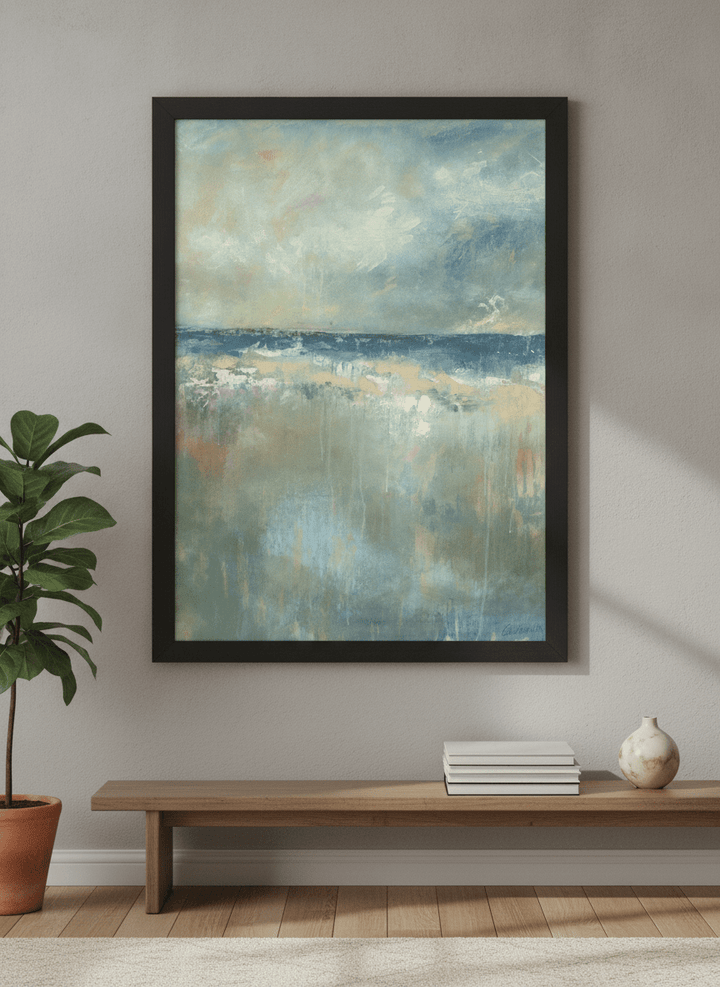 Modern wall art styled above a sofa in a neutral living room