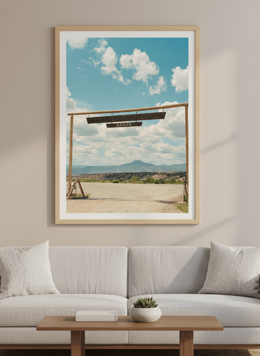 Modern wall art styled above a sofa in a neutral living room