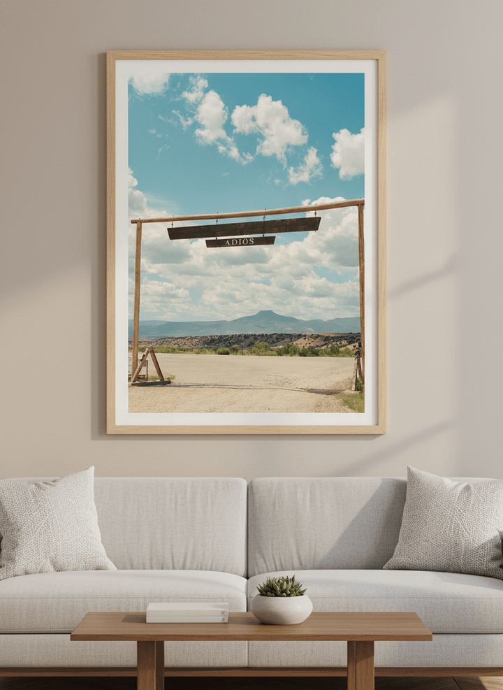 Modern wall art styled above a sofa in a neutral living room