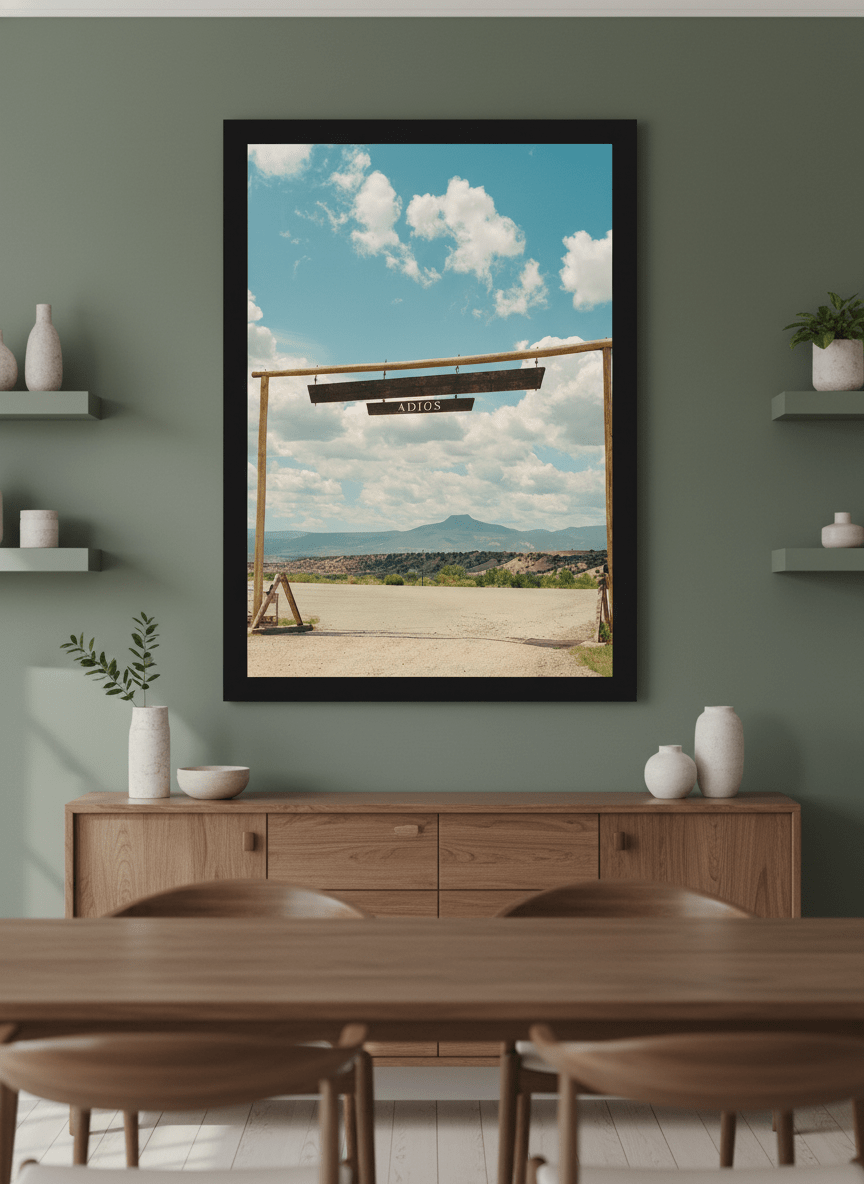 Wall art styled above a dining table in a contemporary home