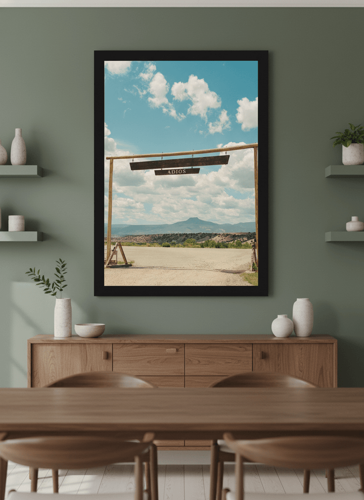 Wall art styled above a dining table in a contemporary home