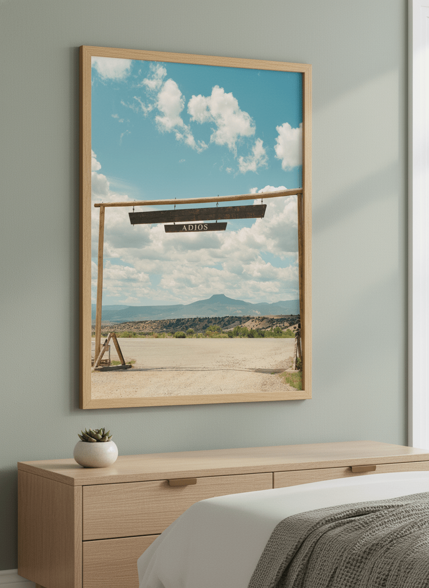 Minimalist artwork displayed in a calm, light-filled bedroom interior