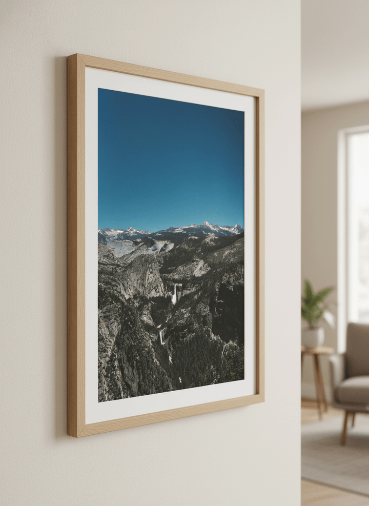 Modern wall art styled above a sofa in a neutral living room