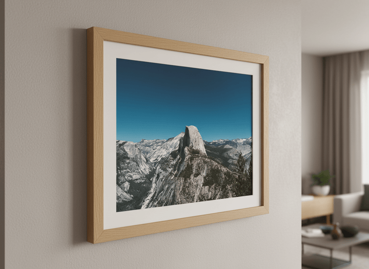 Modern wall art styled above a sofa in a neutral living room