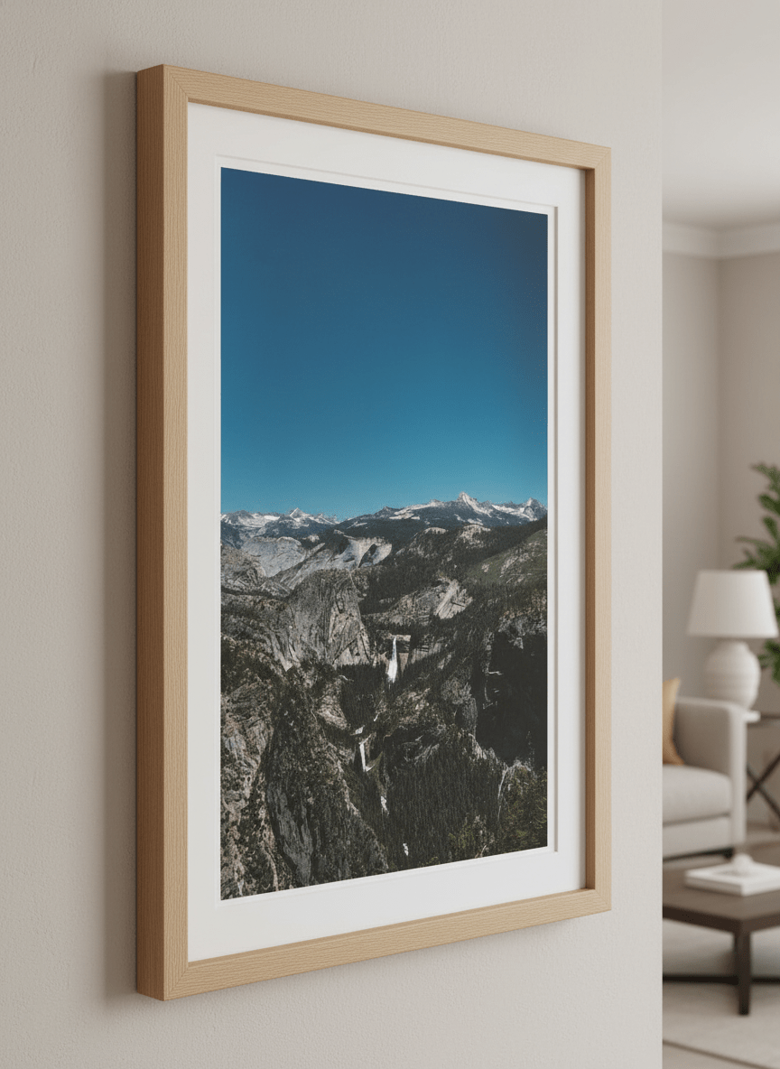 Modern wall art styled above a sofa in a neutral living room