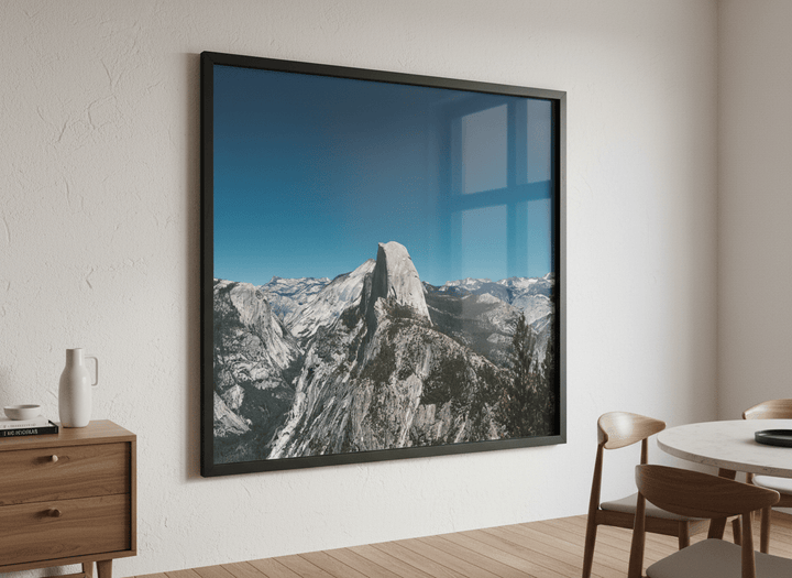 Wall art styled above a dining table in a contemporary home