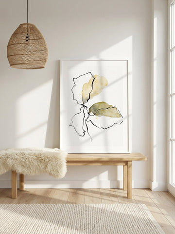 Modern wall art print standing on a bench in a bright Scandinavian home office