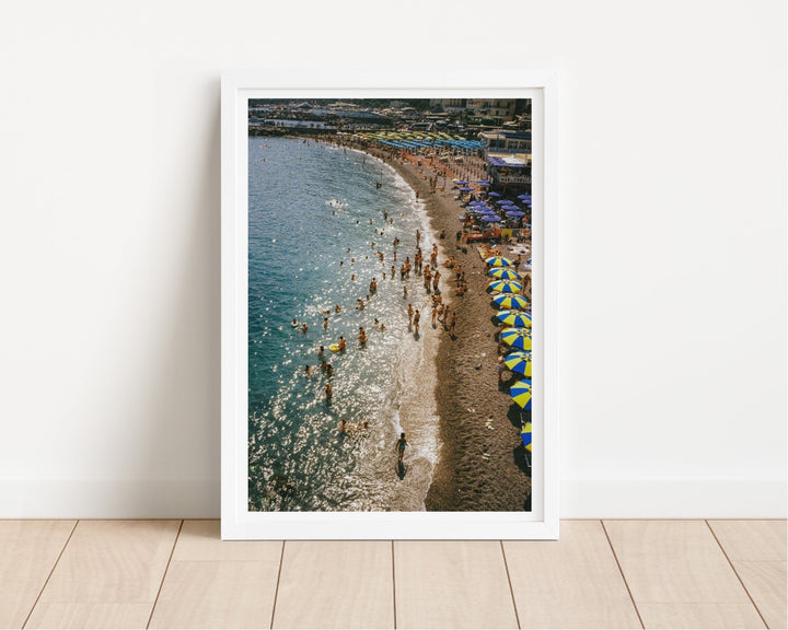 photo of beach on wooden floor leaning against white wall