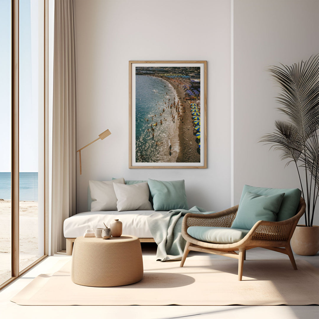 coastal nook with chair and coffee table and photo hanging on wall