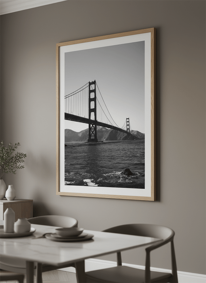 Wall art styled above a dining table in a contemporary home
