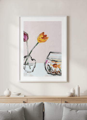 Modern wall art styled above a sofa in a neutral living room