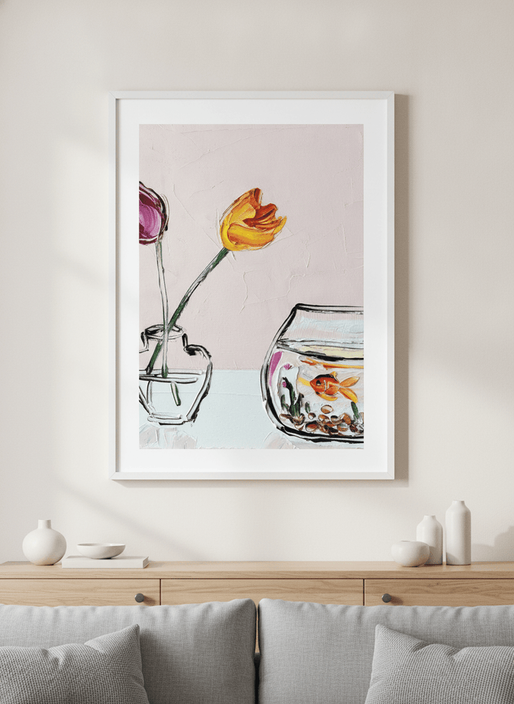 Modern wall art styled above a sofa in a neutral living room