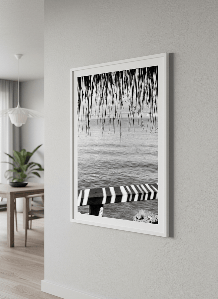 Wall art styled above a dining table in a contemporary home