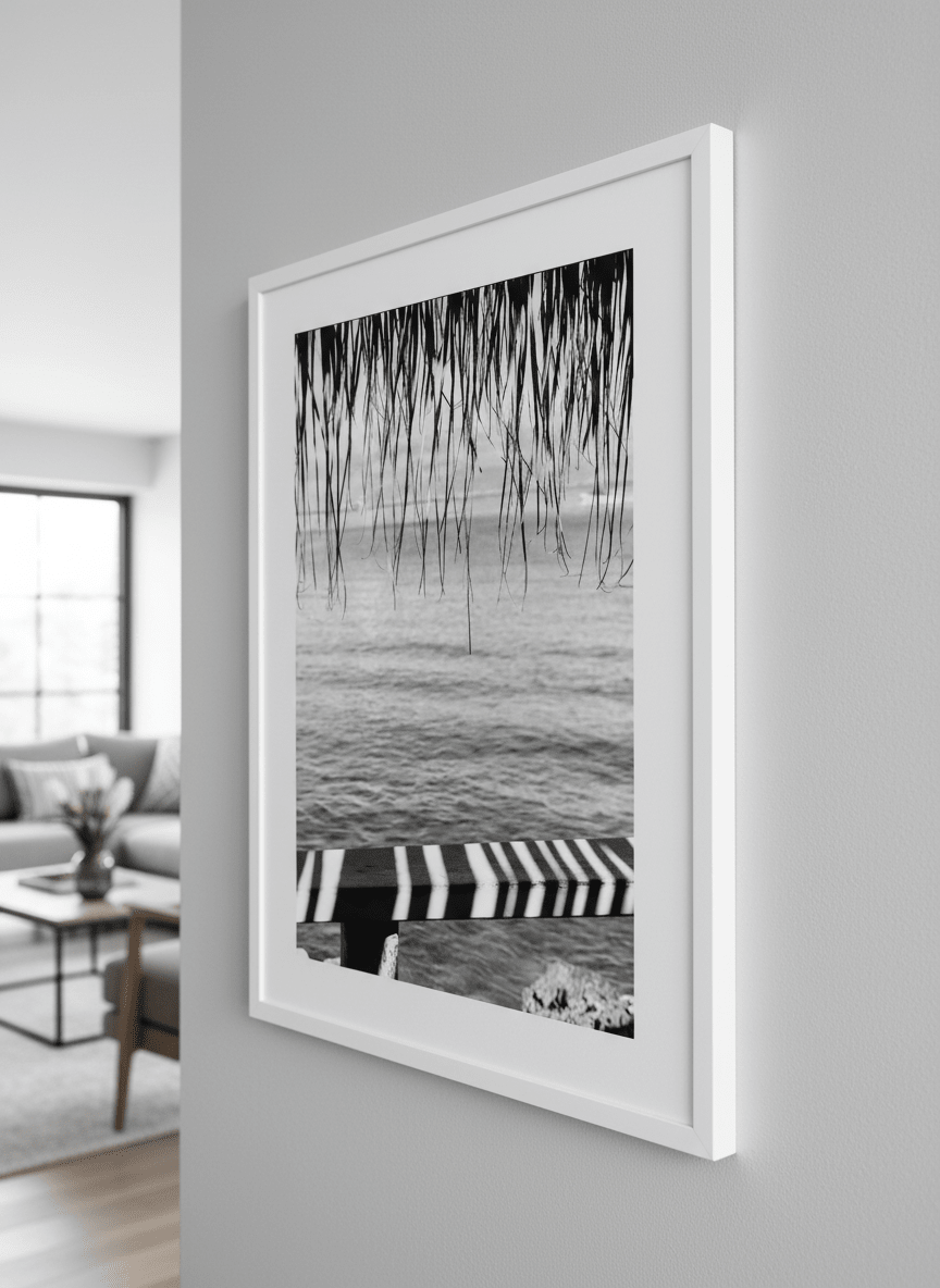 Modern wall art styled above a sofa in a neutral living room