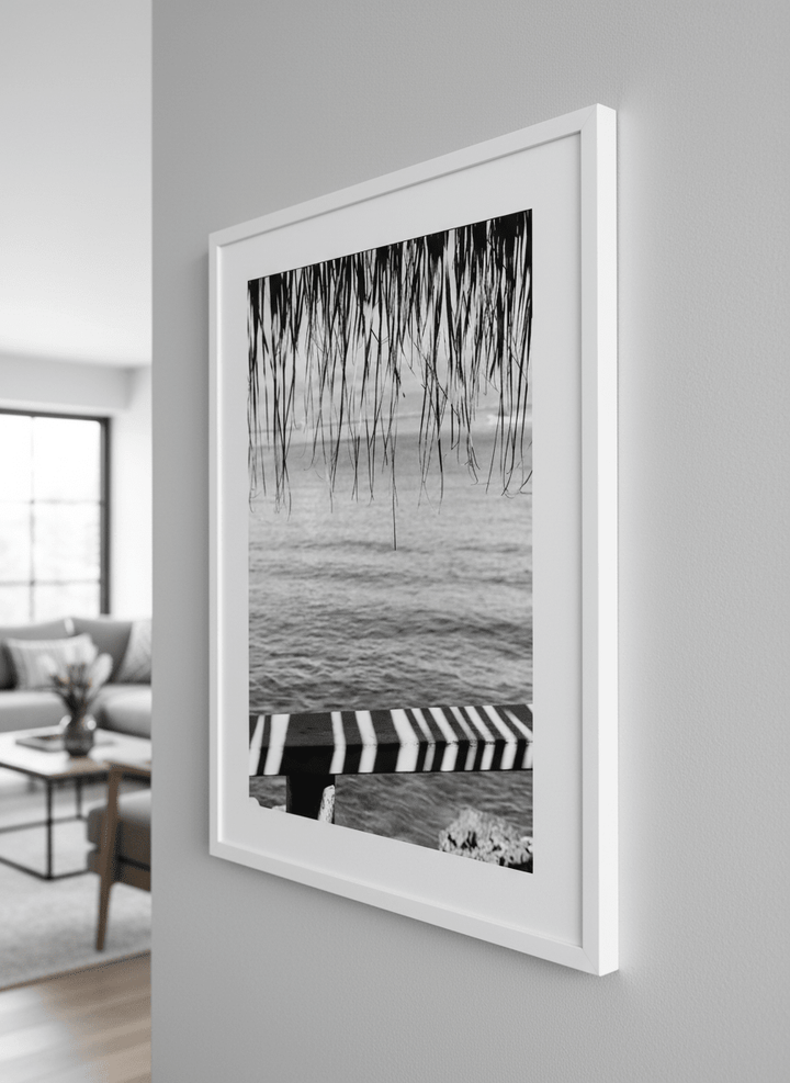 Modern wall art styled above a sofa in a neutral living room