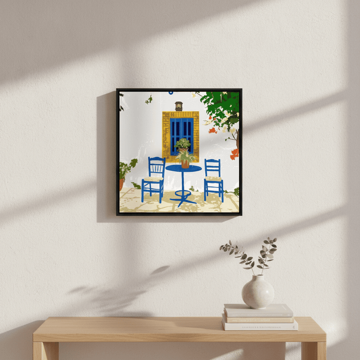 Canvas wall art with a black surround styled in a bright modern kitchen