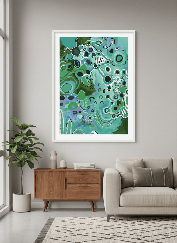Modern wall art styled above a sofa in a neutral living room