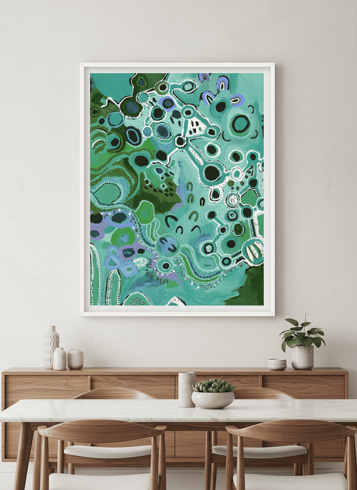 Wall art styled above a dining table in a contemporary home