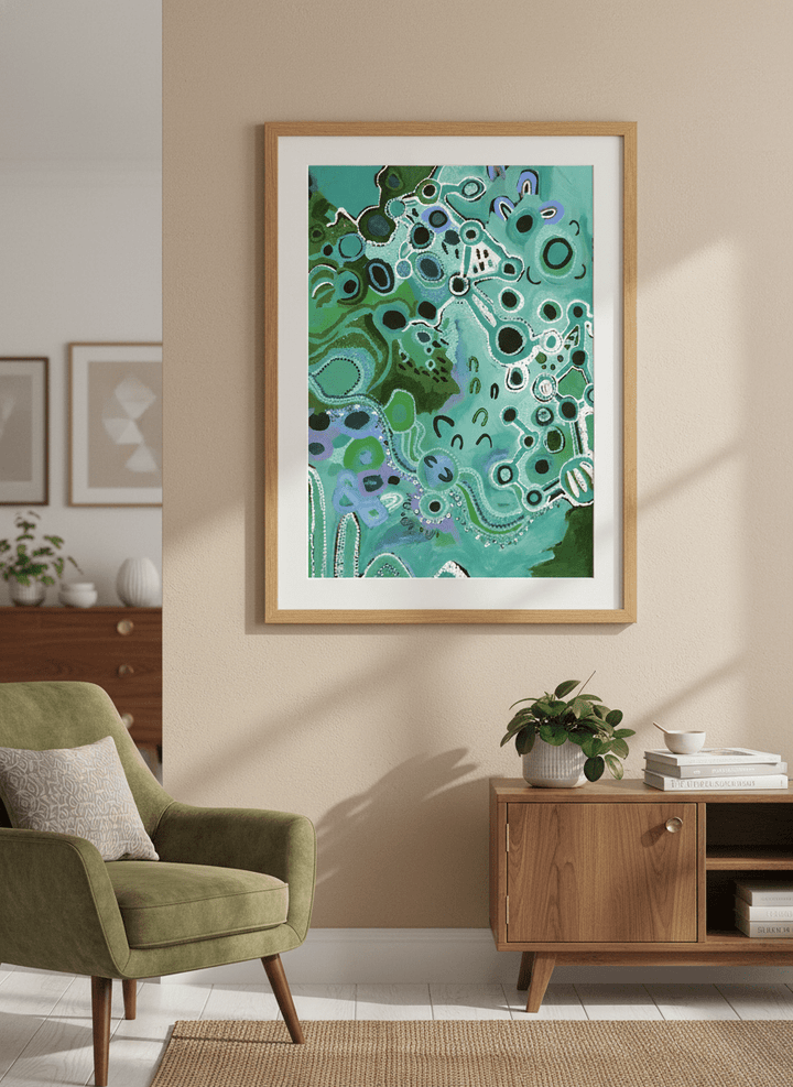 Modern wall art styled above a sofa in a neutral living room