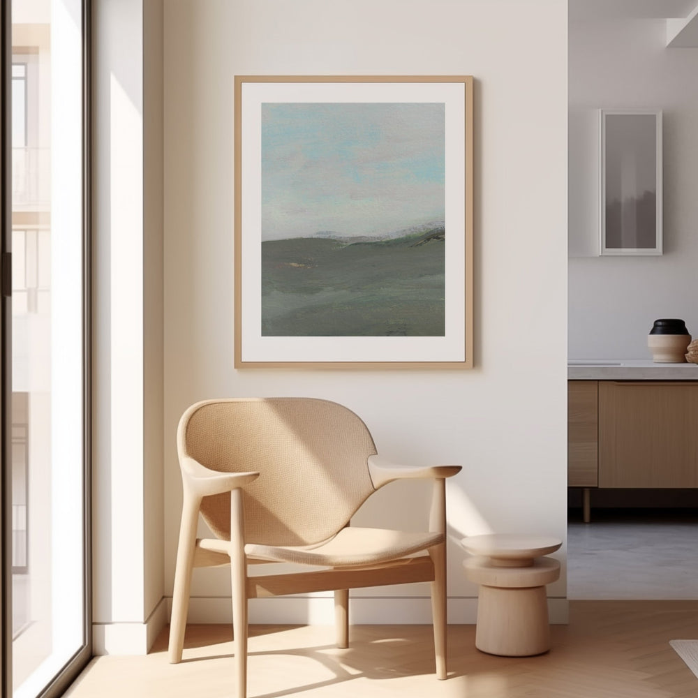 Beige armchair in a modern room with artwork on the wall