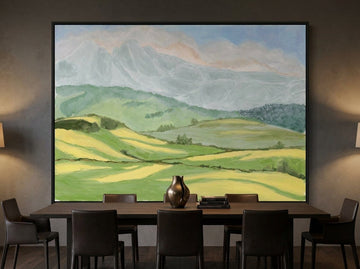 Oversized statement canvas wall art with a black surround styled on the wall in a moody dining room