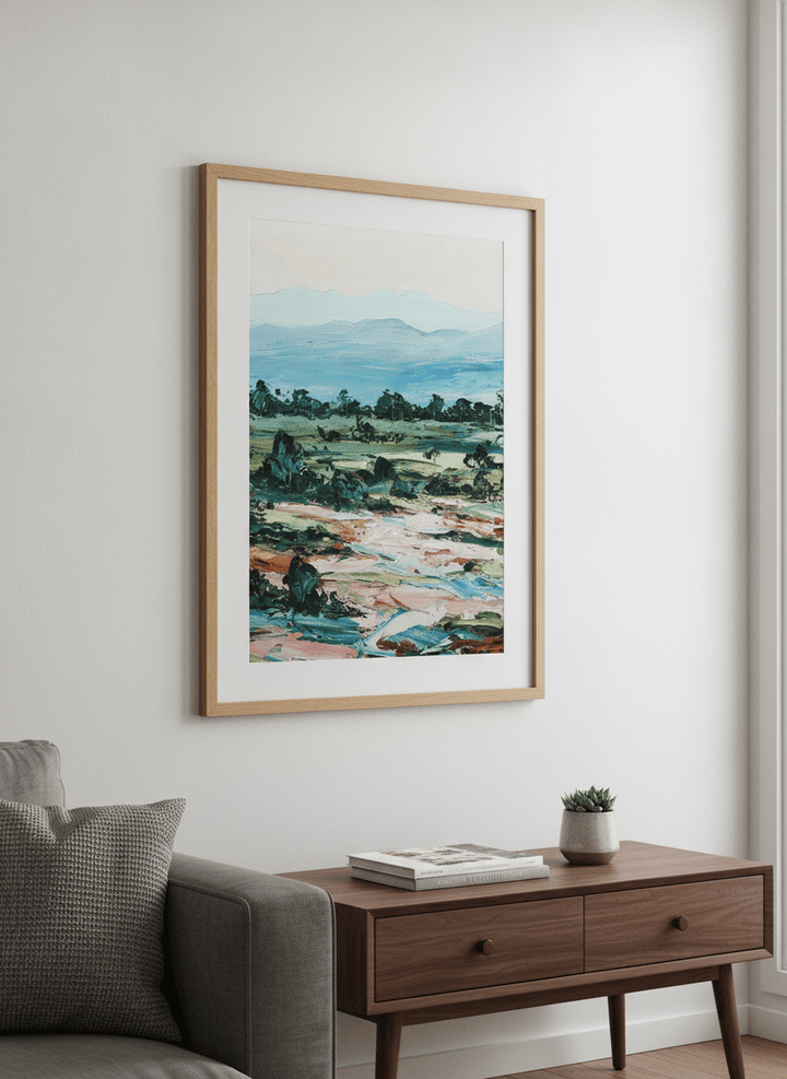 Modern wall art styled above a sofa in a neutral living room