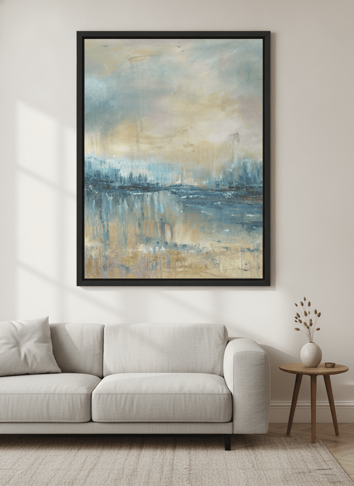 Modern wall art styled above a sofa in a neutral living room