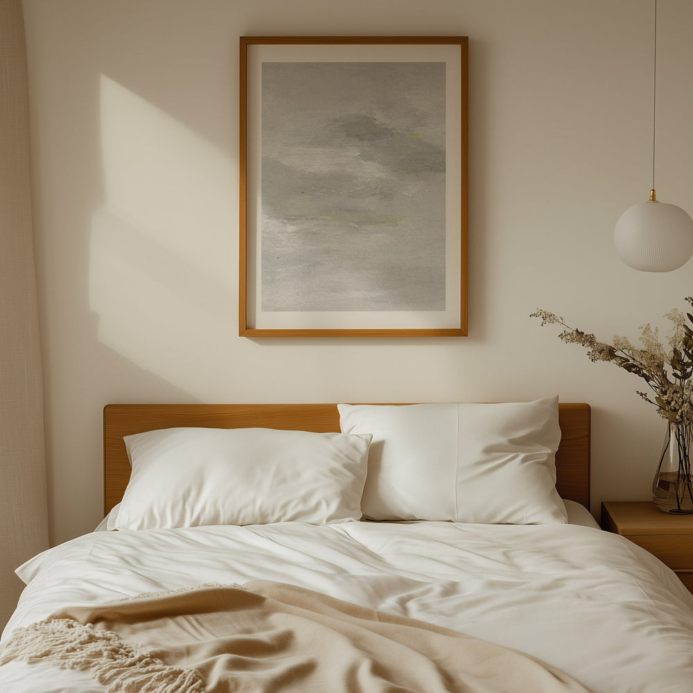 Neatly made bed with white pillows and a wooden headboard, artwork on the wall.