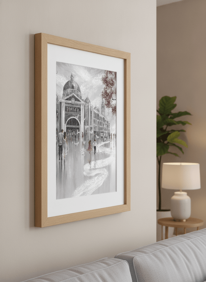 Modern wall art styled above a sofa in a neutral living room