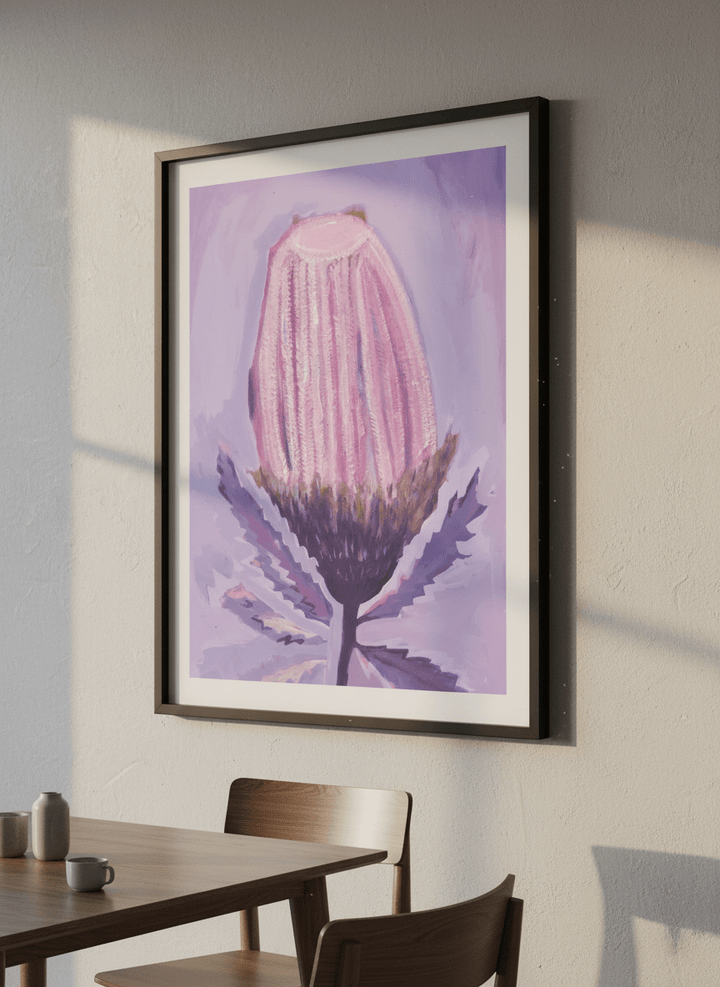 Wall art styled above a dining table in a contemporary home