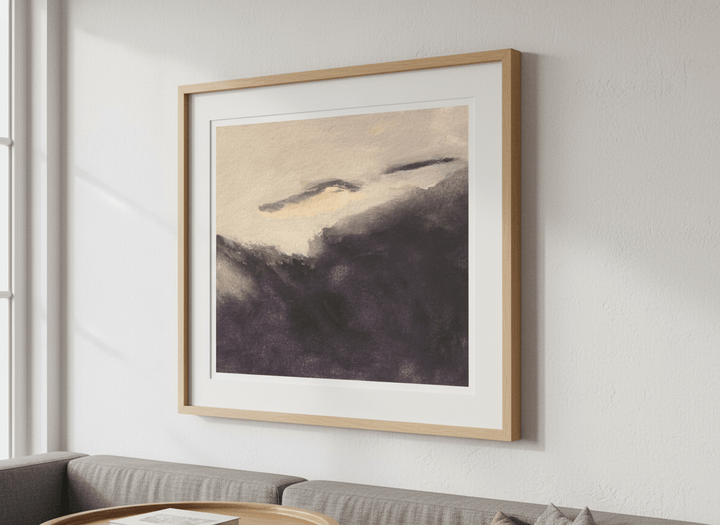 Modern wall art styled above a sofa in a neutral living room