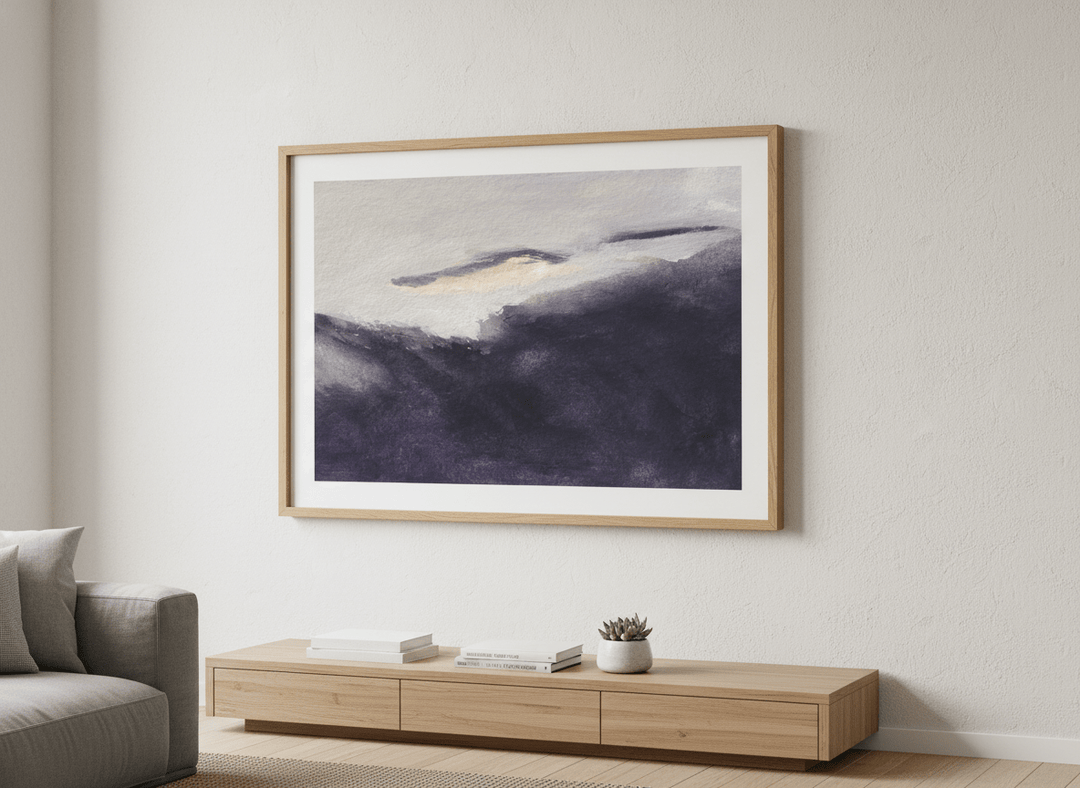 Modern wall art styled above a sofa in a neutral living room
