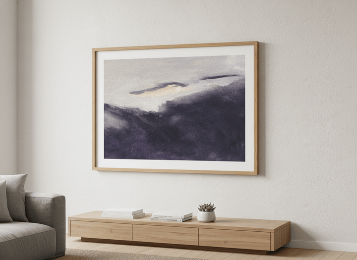 Modern wall art styled above a sofa in a neutral living room