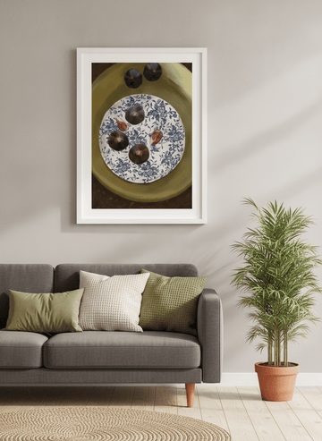Modern wall art styled above a sofa in a neutral living room