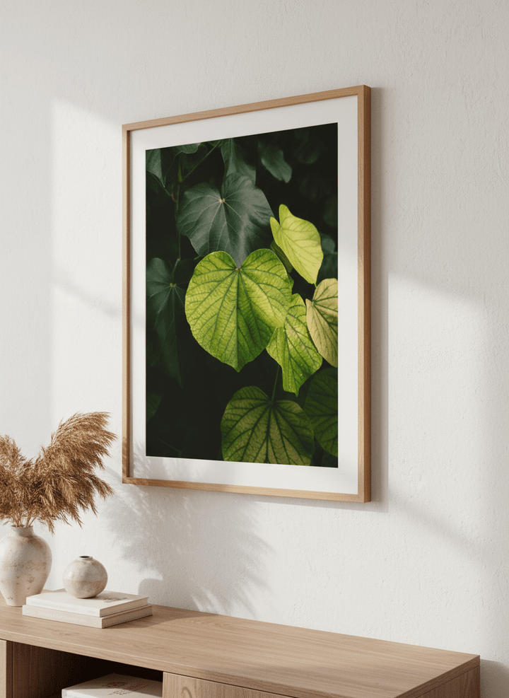 Modern wall art styled above a sofa in a neutral living room