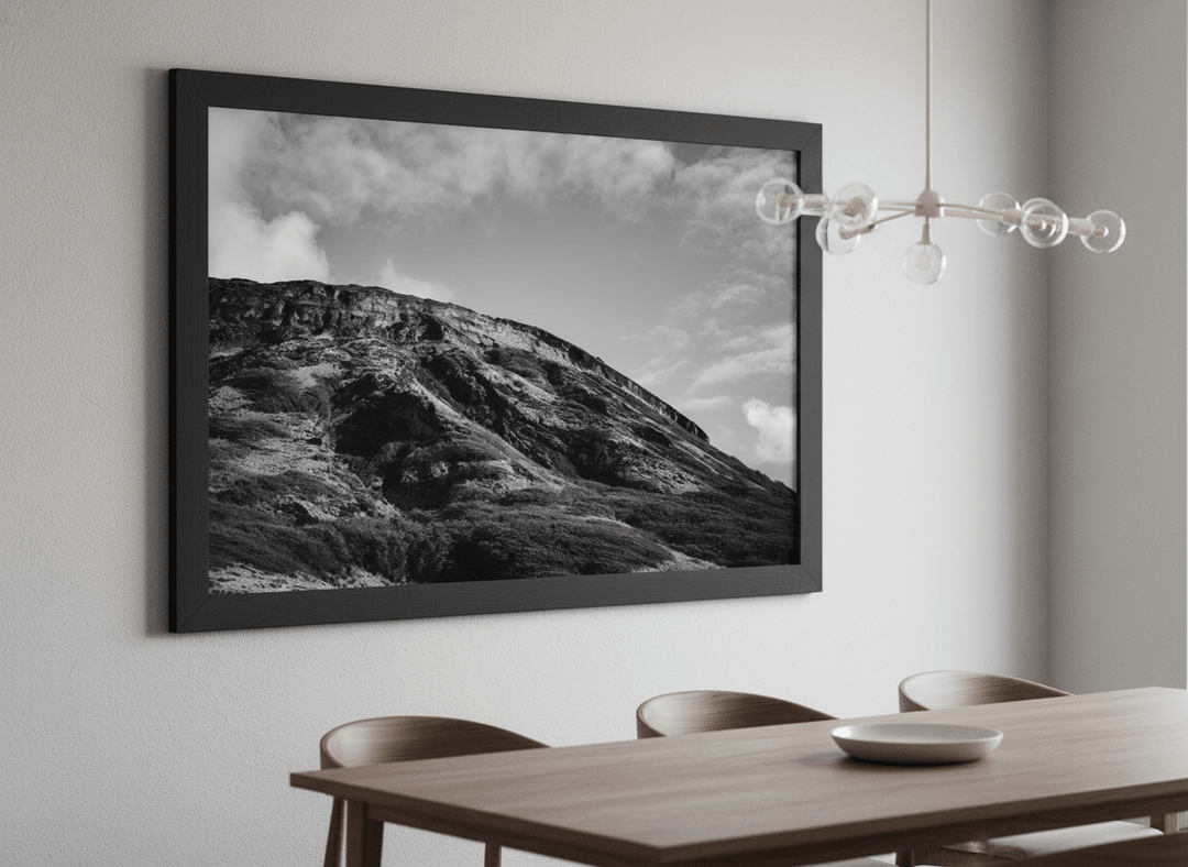 Wall art styled above a dining table in a contemporary home