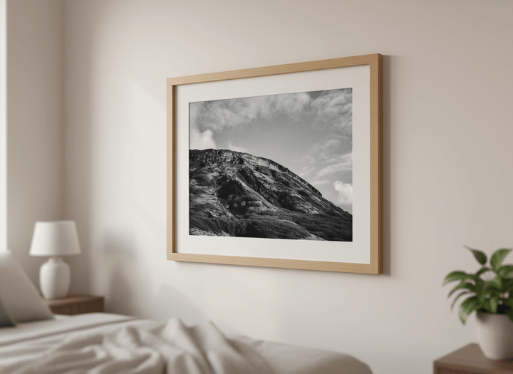 Minimalist artwork displayed in a calm, light-filled bedroom interior