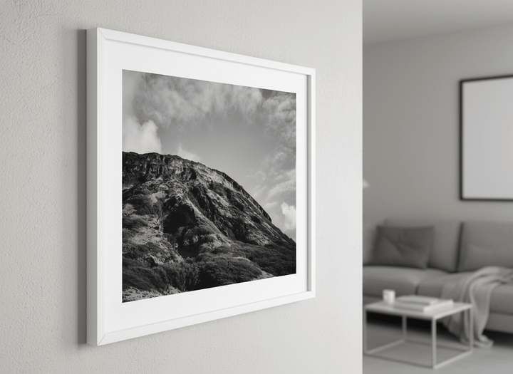 Modern wall art styled above a sofa in a neutral living room